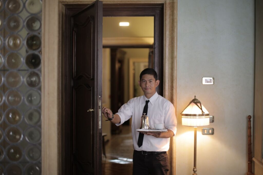 Hotel staff serving guests for hospitality manpower supply