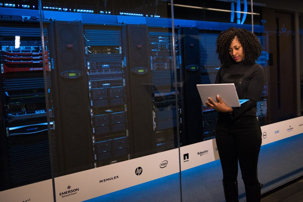 IT engineer working beside server racks