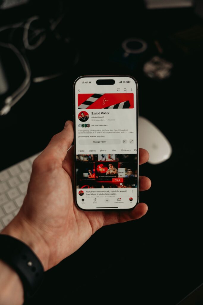 Hand holding a smartphone with an open business mobile app